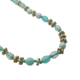 Collier doré perles turquoise, couronnes dorées et noeuds turquoise 42 cm