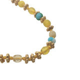 Collier doré perles jaunes et turquoise, couronnes dorées et noeuds jaunes 42 cm