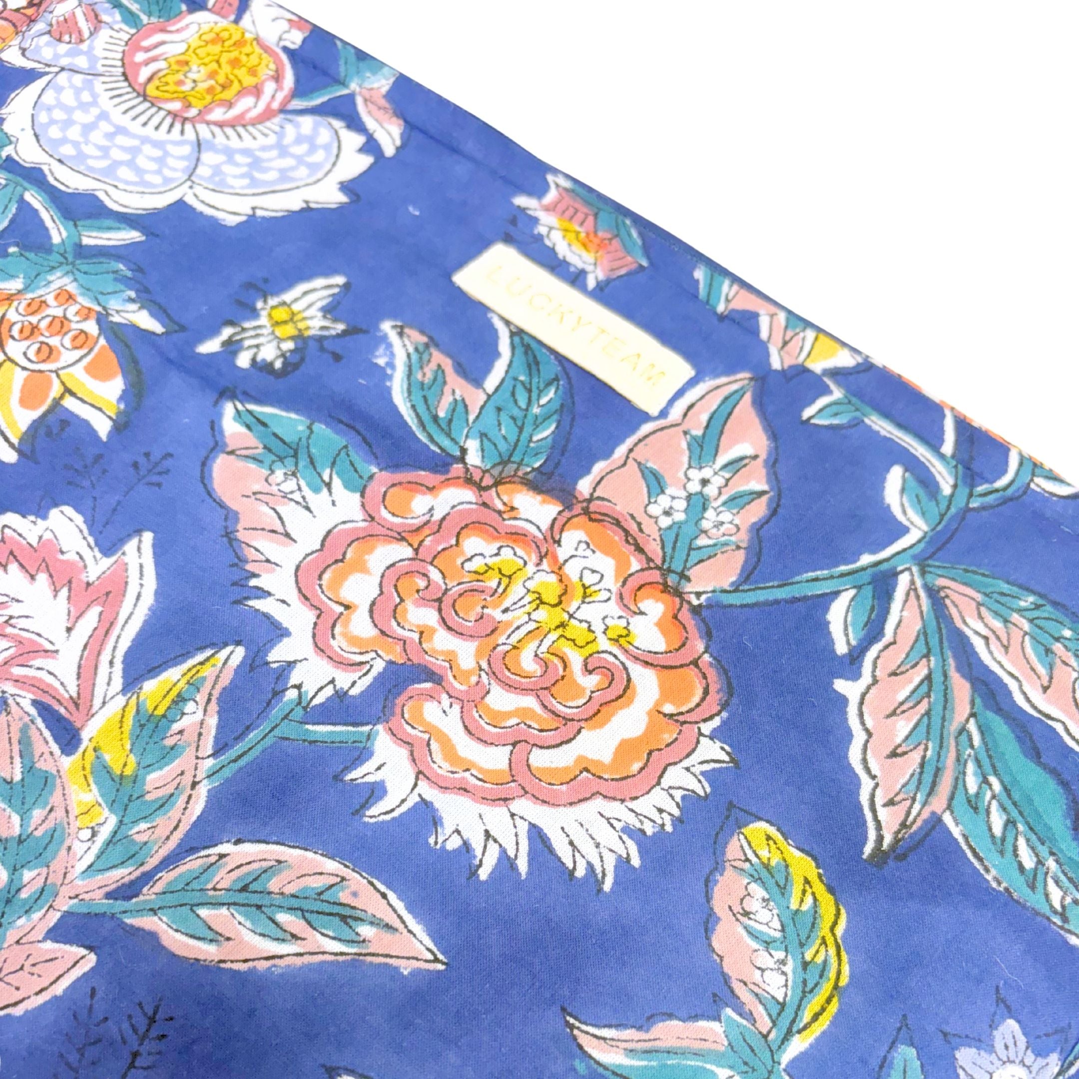 Grande pochette de voyage bleu marine à fleurs oranges et blanches