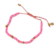 Bracelet vinyle rose et blanc et disques dorés