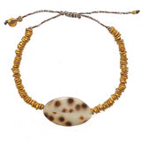 Bracelet cordon disques dorés et coquillage
