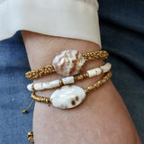 Bracelet cordon disques dorés et coquillage