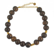 Bracelet de cheville doré et perles de bois