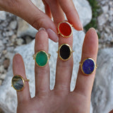 Gold ring and flat oval stone